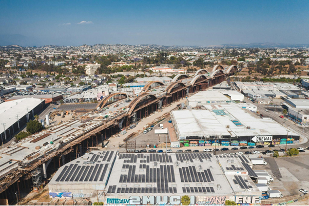 Aerial view of urban buildings with integrated solar panel systems